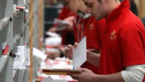 PA Media Royal Mail had hired temporary Christmas staff to try and deal with the backlog of deliveries