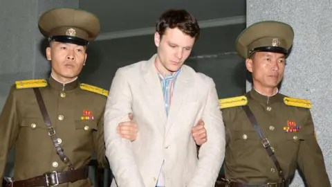 Reuters Otto Frederick Warmbier, flanked by two North Korean guards