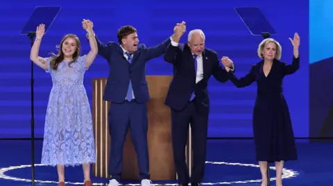 Tim Walz and his family on stage 