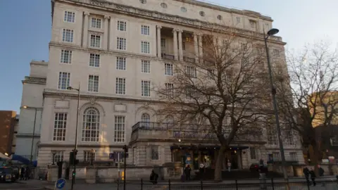 The exterior of The Adelphi Hotel at dusk