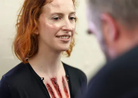 BBC Alex Gent applying make up to Lauren Jane Barnett