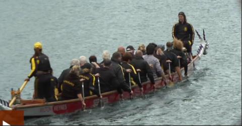 Competitors in their dragon boat before the race