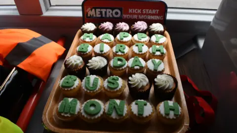 Alex Seabrook Cupcakes with icing that reads: "Happy bus birthday"