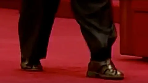 Reuters North Korean leader Kim Jong-un wears sandals and socks at a military exhibition