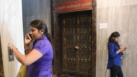 Getty Images Two women outside closed PNB branch
