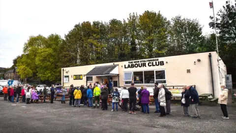 Getty Images Queue of people outside Stalybridge Labour Club, Manchester