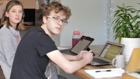 Jackson and his sister Mari learning from home