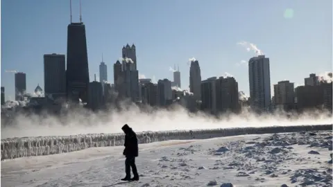 Getty Images A man walks along the lakefront in Chicago