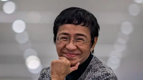 Getty Images Nobel Peace Prize-winning Filipino journalist Maria Ressa speaks during the launch of her new book "How to Stand Up to a Dictator" on December 10, 2022 in Pasig, Metro Manila, Philippines.