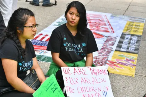 AFP "Dreamers" protest against the cancellation of Daca in front of the US embassy in Mexico City, 5 September