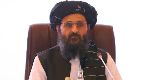 AFP The leader of the Taliban negotiating team Mullah Abdul Ghani Baradar looks on during the final declaration of the peace talks between the Afghan government and the Taliban is presented in Qatar's capital Doha on July 18, 2021