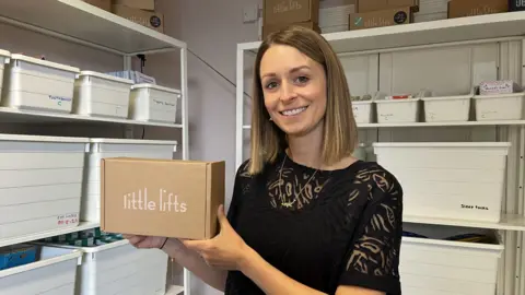 Little Lifts Oa Hackett holding a Little Lifts gift box