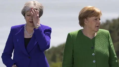 EPA Theresa May and German Chancellor Angela Merkel at the G7 summit in Canada