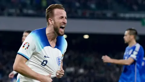 Harry Kane celebrates as England beat Italy