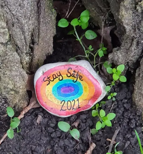 Michelle Pack "Stay safe" painted on a rock
