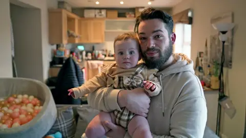 BBC Sean and his nine-month-old daughter Isla