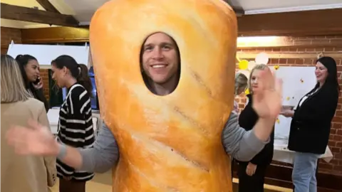 Amelia Murs/Instagram Olly Murs dressed in a sausage roll costume