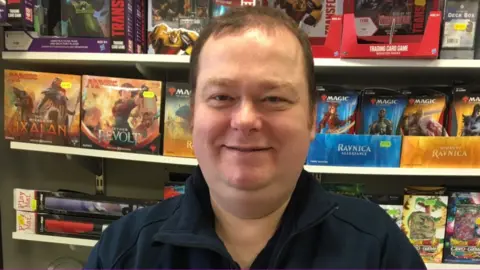 BBC Paul Thomas in his comic and games shop