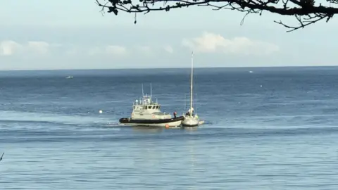 States of Jersey Border Agency Yacht being boarded by border agents