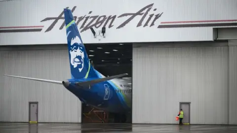 Getty Images Alaska Airlines N704AL is seen grounded in a hangar at Portland International Airport on January 9, 2024 in Portland, Oregon.