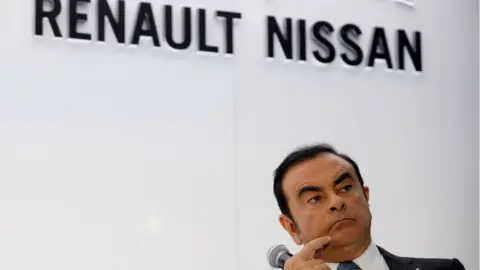 Getty Images CEO of Renault-Nissan Carlos Ghosn listens while attending a joint press conference along with CEO of German automaker Daimler Dieter Zetsche at the Paris Motor Show on September 30, 2016.