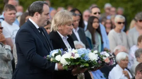 PA Paul Wheelhouse and Baroness Goldie with wreaths