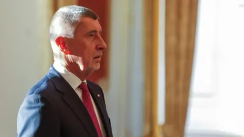 Reuters ANO party leader Andrej Babis stands on the day Czech President Petr Pavel appoints him as the country's new Prime Minister at Prague Castle in Prague, Czech Republic December 9, 2025.