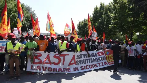 EPA Migrant workers protesting against their working conditions in Foggia, August 2018