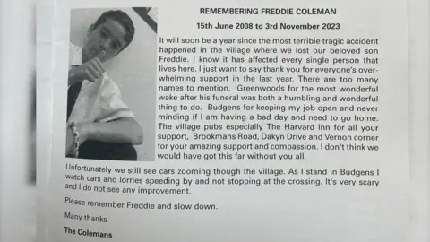 Stock Press This section of a the village newsletter contains a black and white picture of Freddie giving a thumbs up and a note from the Coleman family. It reads: 
REMEMBERING FREDDIE COLEMAN - 15th June 2008 to 3rd November 2023. It will soon be a year since the most terrible tragic accident happened in the village where we lost our beloved son Freddie. I know it has affected every single person that lives here. I just want to say thank you for everyone's overwhelming support in the last year. There are too many names to mention. Greenwoods for the most wonderful wake after his funeral was both a humbling and wonderful thing to do. Budgens for keeping my job open and never minding if am having a bad day and need to go home.
The village pubs especially The Harvard Inn for all your support, Brookmans Road, Dakyn Drive and Vernon corner for your amazing support and compassion. I don't think we would have got this far without you all.
Unfortunately we still see cars zooming though the village. As I stand in Budgens I watch cars and lorries speeding by and not stopping at the crossing. It's very scary and I do not see any improvement.
Please remember Freddie and slow down. Many thanks, The Colemans
