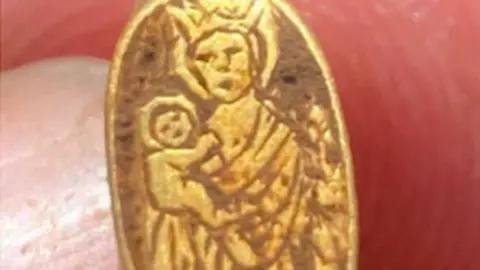 Matthew Hepworth The ring featuring baby Jesus being held by the Virgin Mary