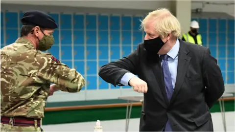 Getty Images Boris Johnson at a vaccination centre