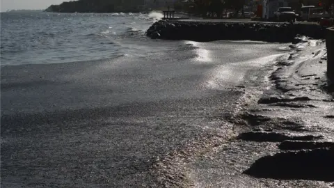 AFP via Getty Images Oil covers Rockly Bay on Tobago island, Trinidad and Tobago. Photo: 10 February 2024