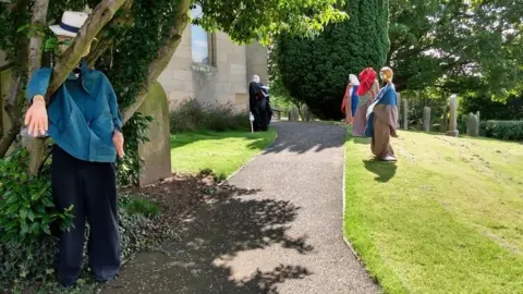 Paul Weston Scarecrows in churchyard