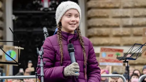 AFP Swedish climate activist Greta Thunberg speaks on stage during a demonstration of students calling for climate protection on 1 March 2019 in front of the city hall in Hamburg, Germany