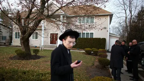 AFP man outside rabbi's house