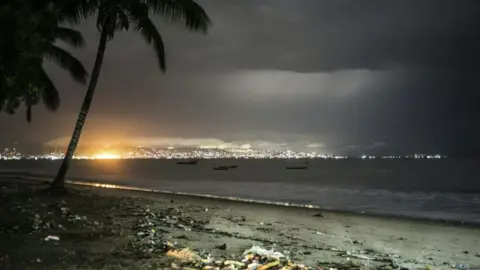 AFP/Getty Freetown skyline from the beach from where the ferries linking the airport to the Sierra Leone capital leave