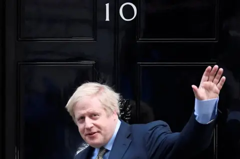 Toby Melville / Reuters Boris Johnson waves as he arrives at Downing Street