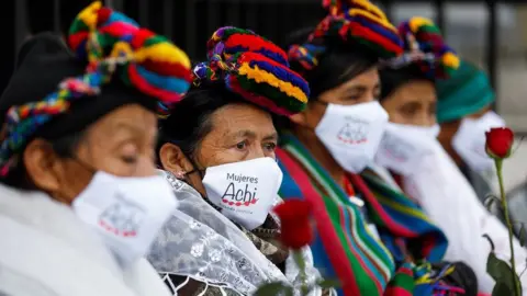 Reuters Women gather during the trial of five former Guatemalan paramilitaries charged with the rape of 36 women from the indigenous Achi group from 1981 to 1985