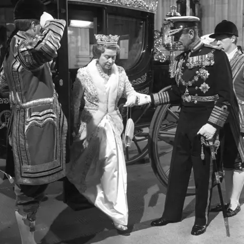 PA Media The Duke of Edinburgh helping Queen Elizabeth II to alight from the new £120,000 Australia State Coach, Australia's bicentennial gift, at the Houses of Parliament as they arrive for the State Opening