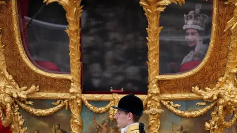 Getty Images The Queen appeared as a hologram inside the Gold State Coach