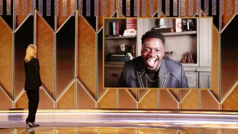 Reuters Laura Dern presenting Daniel Kaluuya with his award for best supporting actor