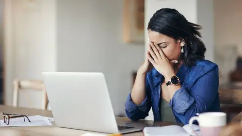 Getty Images Indebted woman