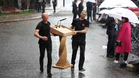 Reuters The Downing Street lectern is moved inside