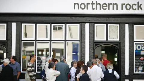 Getty Images Customers queue outside a Northern Rock branch in 2007