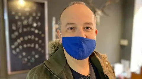 Robby West/BBC Paul Mallett