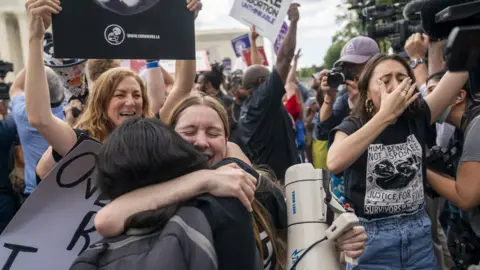 EPA 0 Anti-abortion activists react following the courts decision on the Dobbs v Jackson Women"s Health Organization ruling outside the Supreme Court in Washington, DC, USA, 24 June 2022