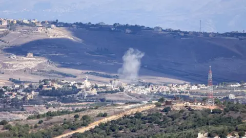 AFP Smoke rises after an artillery strike near the Lebanon border village of Yaroun on 21 November 2023, as seen from northern Israel