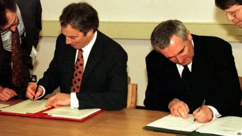 PA Tony Blair and Bertie Ahern sign the agreement