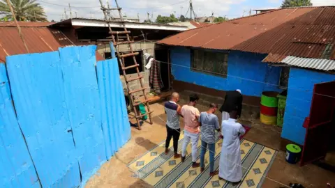 Reuters Muslim faithful perform Eid al-Fitr prayers, marking the end of the holy fasting month of Ramadan, at a courtyard within their home as mosques remain closed amid concerns about the spread of the coronavirus disease (COVID-19), in Nairobi, Kenya, May 24, 2020.