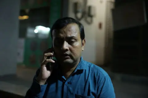 Reuters Prashant Patel, 45, whose 17-year-old son Kahaan Patel took his own life ahead of the NEET exam retest, speaks on the phone